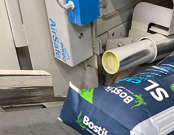 Close-up of ENVEA's AirSafe monitoring system integrated into a bagging machine, ensuring the detection of incompletely sealed bags. This innovative solution enhances product quality control and operational efficiency in industrial packaging processes.